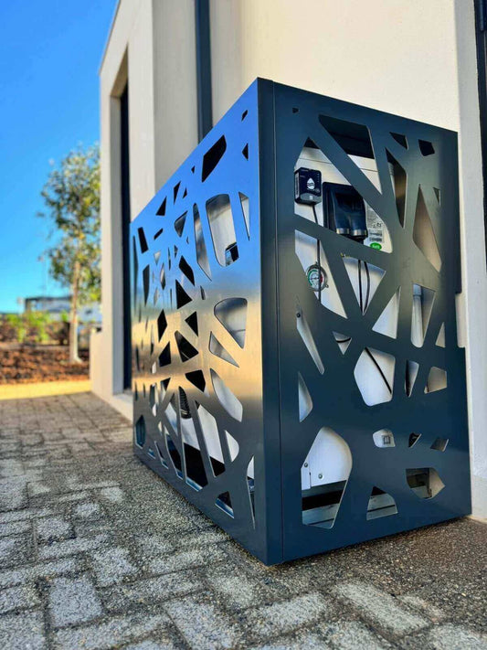 Stylish air conditioner cover by Tilt, made from weather-resistant aluminum composite, providing elegance and airflow.